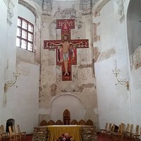 Look at the pigeons at the bottom of the cross