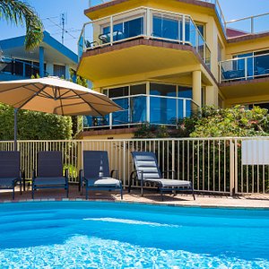 Baywatch pool with children walk ledge, Sun lounges and rotating umbrella