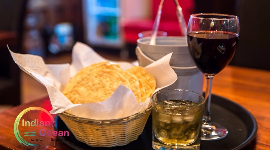 Red wine, Papaddoms, and Chivas on the rocks.