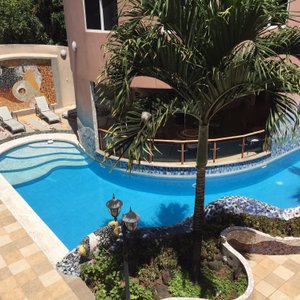 Our relaxing inside courtyard with pool & sun chairs.