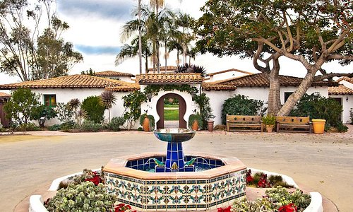 The entrance to Casa Romantica is accented by an ornate fountain with custom Spanish tiles.