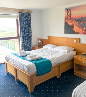 The Beach Motel in Anglesey, image may contain: Bed, Furniture, Dorm Room, Bedroom