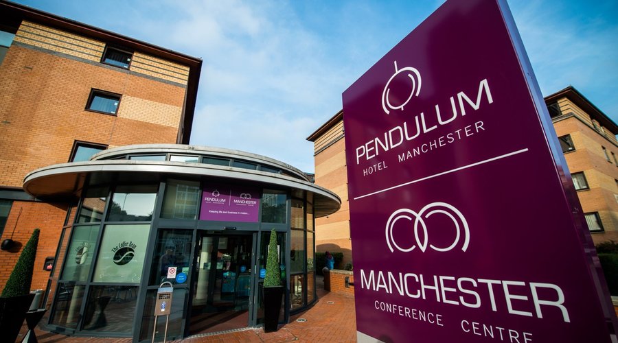 Impressive facade of The Pendulum Hotel displaying its red-brick Victorian architecture