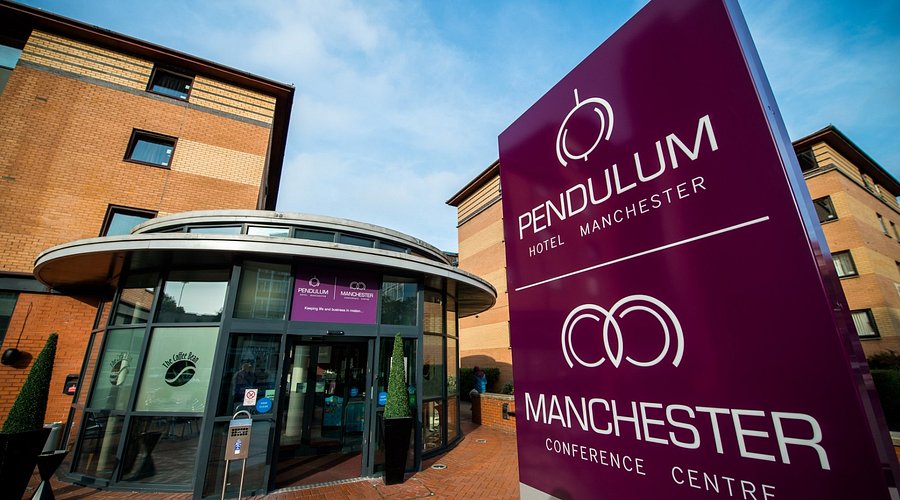 Impressive facade of The Pendulum Hotel displaying its red-brick Victorian architecture