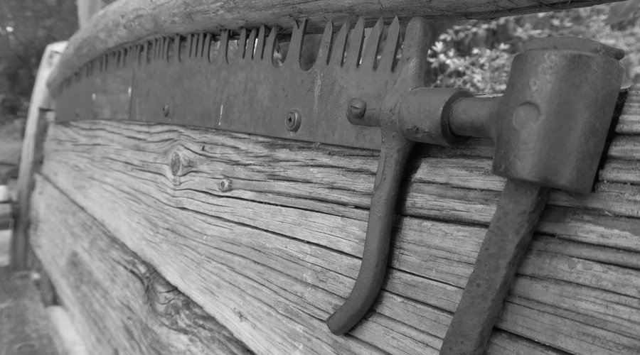 Someone used an old saw as part of a bench.