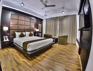 Hotel Heritage Luxury in Srinagar, image may contain: Interior Design, Lamp, Ceiling Fan, Wood