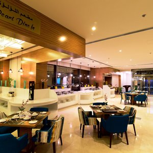 Best Western Plus Pearl Creek in Dubai, image may contain: Lighting, Reception, Table, Monitor