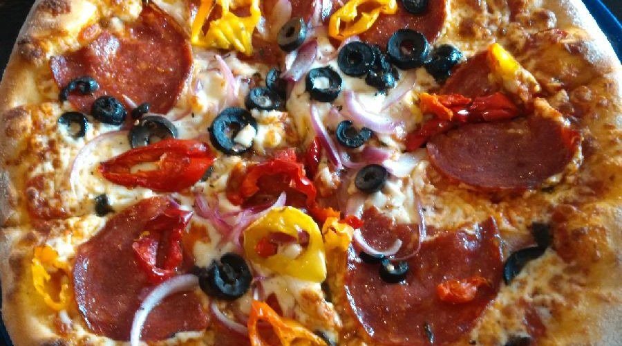 Wood oven pizza-thin crust and laced with flavour