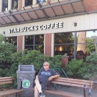 Located next to a chain coffee shop, this park is a popular location for a meet up or relax a bi