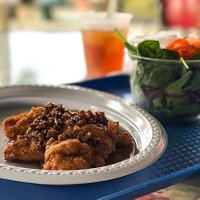 The chicken-fried chicken with honey pecan sauce and salad with Josephine's greens