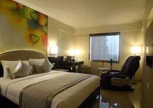 Sai Palace Grand Malad in Mumbai, image may contain: Furniture, Interior Design, Hotel, Bedroom