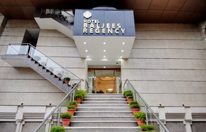 Hotel Baljees Regency in Shimla, image may contain: Staircase, Handrail, Plant, City