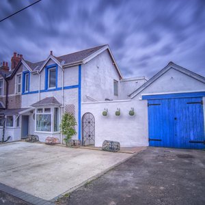 Front of property with 1 space for each room 