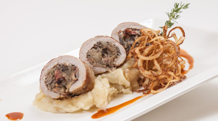 Roasted pork chop ‘Fertőpart’ style filled with bacon, onion and mushroom, served with mashed on