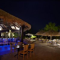 Enjoy Caribbean cocktails at our bar, right on the beach