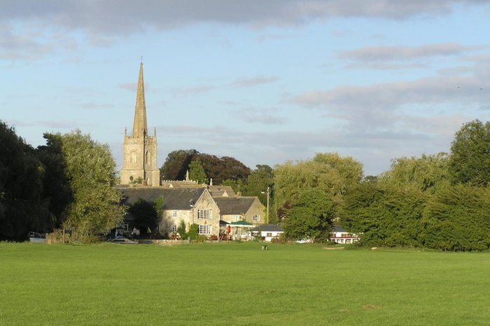 A view across the (unusually empty) open spaces of the Riverside Park towards the town centre.