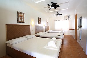 Fat Jimmy's Resort in Panay Island, image may contain: Furniture, Ceiling Fan, Bed, Bedroom