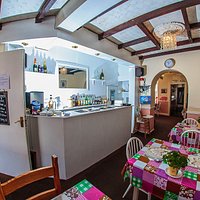 Tables set ready for Sunday Lunch, entrance door to the Left