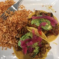chicken tacos with a side of mexican rice