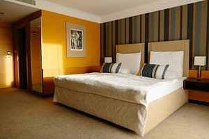 IMPIQ Hotel in Trnava, image may contain: Furniture, Bedroom, Home Decor, Interior Design