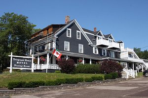 Telegraph House Hotel in Cape Breton Island, image may contain: Neighborhood, Porch, Housing, Villa
