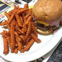 Sweet Carolina Burger - burger topped with smoked pulled pork, melted cheese, and sweet slaw.
