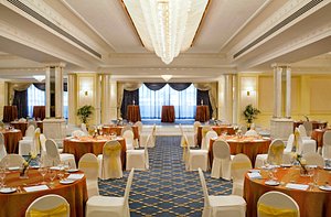 Grand Excelsior Hotel Deira in Dubai, image may contain: Indoors, Reception Room, Dining Table, Dining Room
