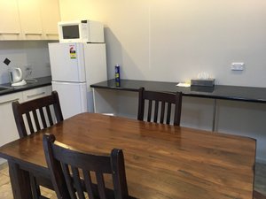 Acacia Golden Way Motel in West Wyalong, image may contain: Table, Dining Table, Wood, Tabletop