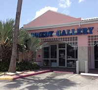 We Are Located in West Shore Center (Pink Plaza) on West Bay Rd, Seven Mile Beach