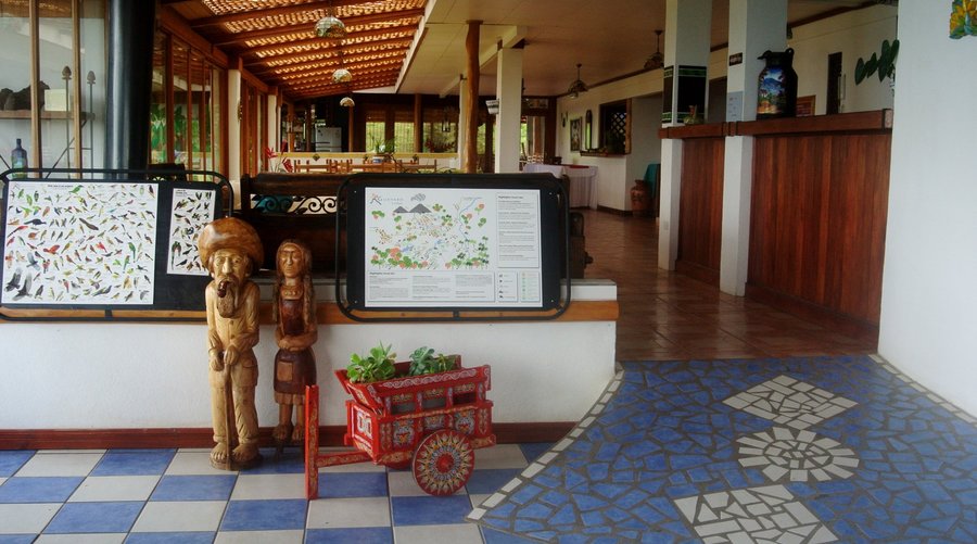 Birds and map of what to do and see in lobby Guayabo Lodge