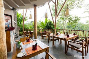 Tejaprana Resort & Spa in Ubud, image may contain: Hotel, Resort, Dining Table, Restaurant
