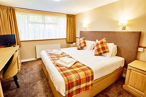 The Abbotsford Hotel in Dumbarton, image may contain: Furniture, Bed, Bedroom, Monitor