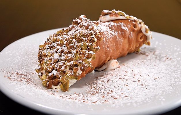 Cannolo- sweet ricotta, crushed chocolate and ends dipped in chopped pistachio