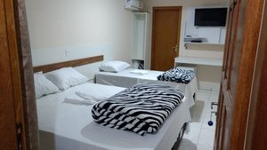 Pousada Imperatriz in Penha, image may contain: Bed, Furniture, Monitor, Bedroom