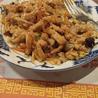 Lunch portion os spicey scheshwen spicey pork with fried rice