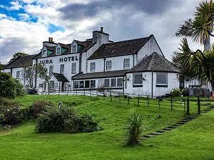 Jura Hotel in Isle of Jura, image may contain: Hotel, Housing, Grass, House