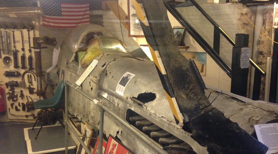 The recovered wreckage of the Mustang on display.