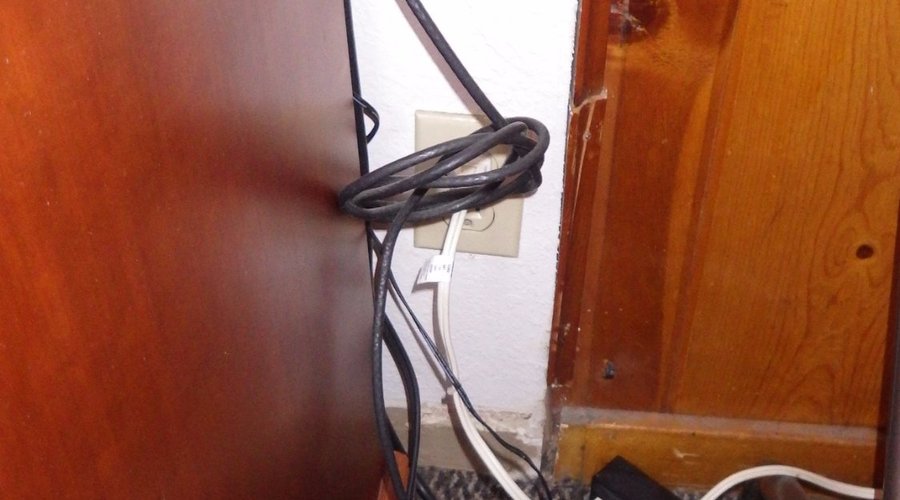 dangerous tangle of electrical cords and extension cords