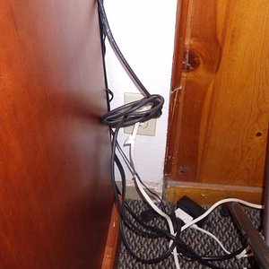 dangerous tangle of electrical cords and extension cords