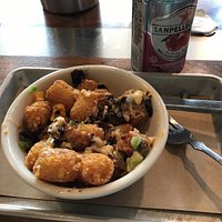 Delicious tater tots with jalapeno cheese sauce