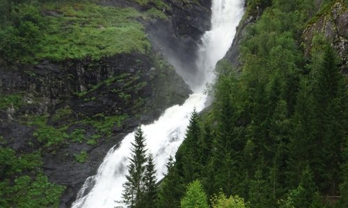 Waterfall, with disused farmhouse and outhouse
