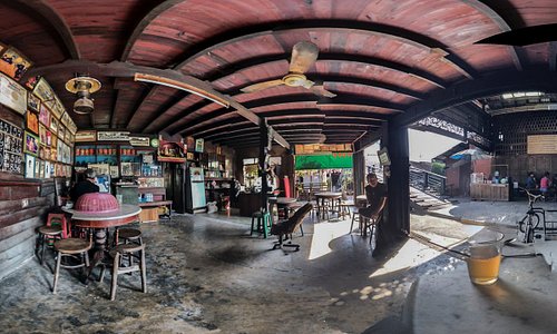 A panoramic view of the coffee and soup eatery at the cor of the wooden bridge