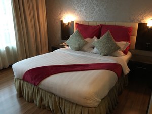 The Mark's Lodge in Sandakan, image may contain: Cushion, Home Decor, Bed, Furniture