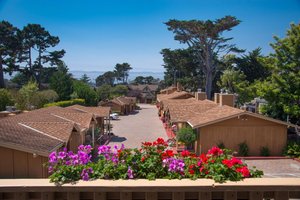 Sunset Inn in Pacific Grove, image may contain: Villa, Hotel, Potted Plant, Resort