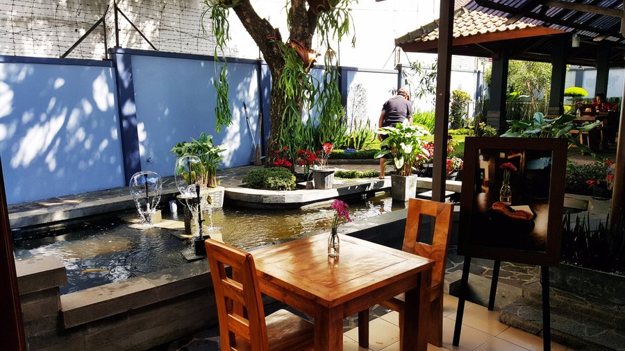 Outdoor dine-in area. Surround with garden and fish pool