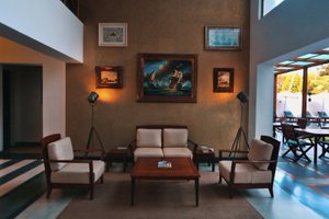 Eighth Bastion, CGH Earth in Kochi (Cochin), image may contain: Waiting Room, Living Room, Couch, Rug