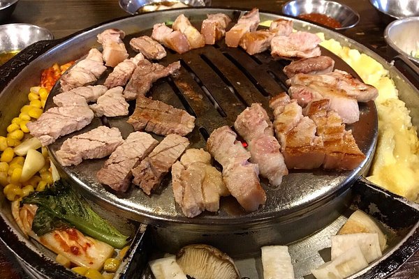 BBQ grill at our table, Amiso Korean Restaurant, Myeongdong District,  Jung-gu, Seoul. - Picture of Amiso, Seoul - Tripadvisor