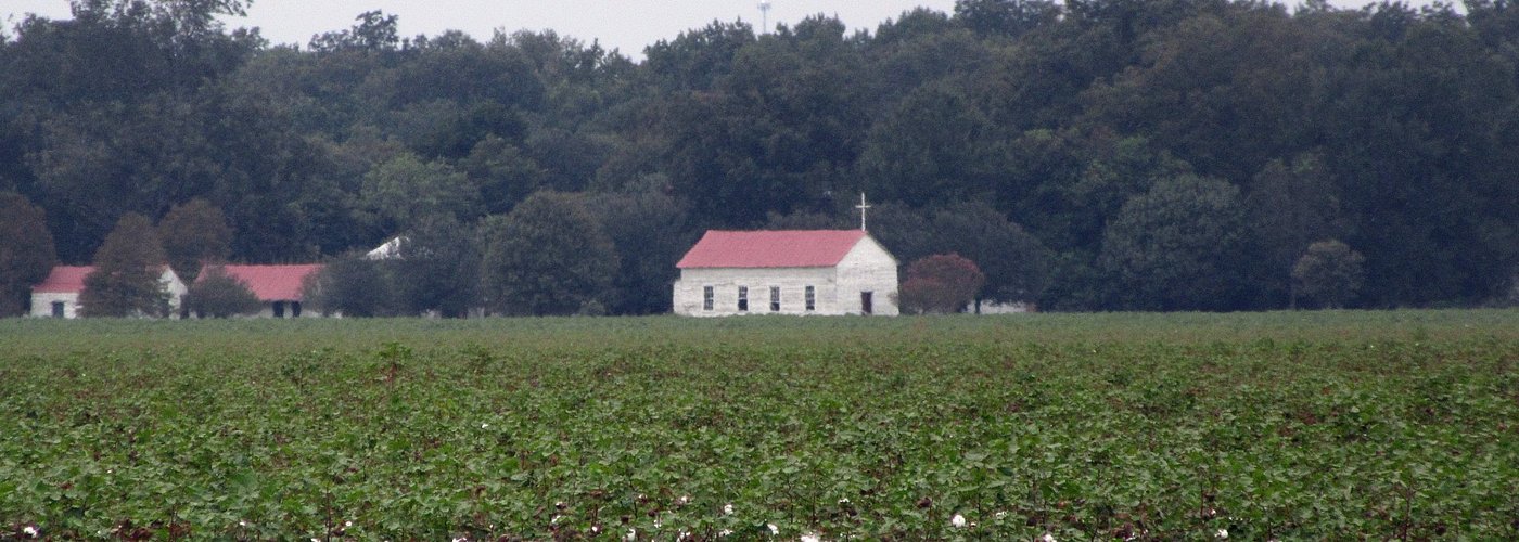 The cotton plantation with the original church still in use.