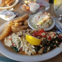 Broiled fish with feta, spinach, and tomatoes. Greek Potatoes.