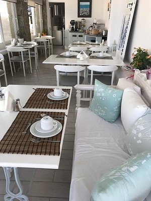 Hotel Spanelis in Mykonos, image may contain: Table, Home Decor, Couch, Tabletop